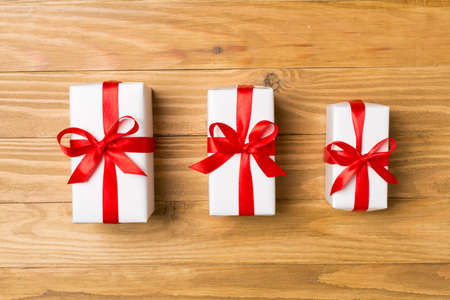 Top view of gift boxes on wooden background.の写真素材