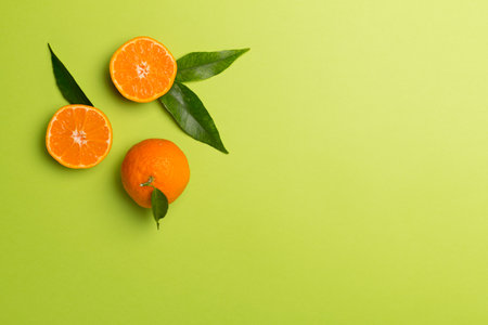 Flat lay with fresh tangerines on color background.の写真素材