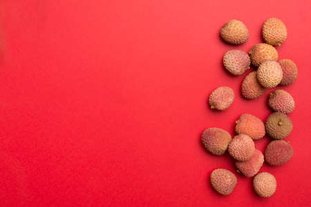 Lychee fruit on color background. Top view, flat lay.の写真素材