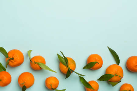 Flat lay with fresh tangerines on color background. top view.の写真素材