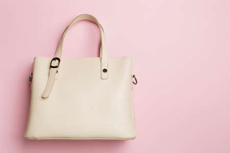 Fashionable woman bag on color background. top view.の写真素材