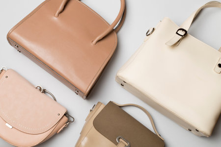 Many women's bags on a color background. top view.の写真素材