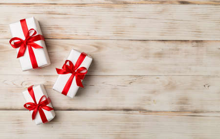 Top view of gift boxes on wooden background.の写真素材