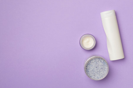 Natural scrub, body cream, shower gel on color background, top view.の写真素材