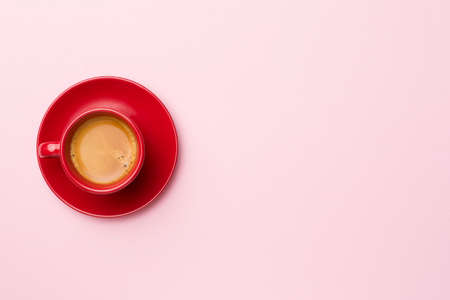 Cup of delicious coffee on color background, top view.の写真素材