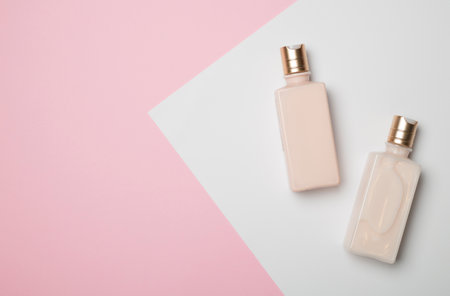 Bottles of cosmetic products on color background.の写真素材