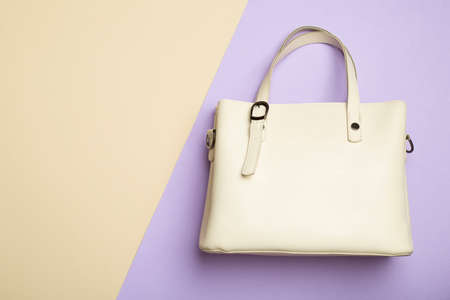 Fashionable woman bag on color background. Top view.の写真素材