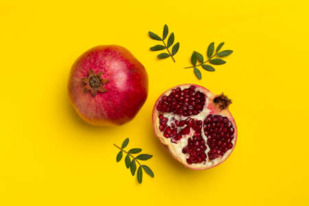Fresh juicy pomegranate on color background, top view.の写真素材
