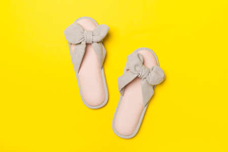 Soft pink slippers on color background, top view.の写真素材