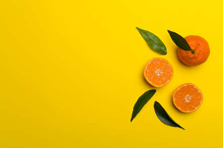 Flat lay with fresh mandarines on color background.の写真素材