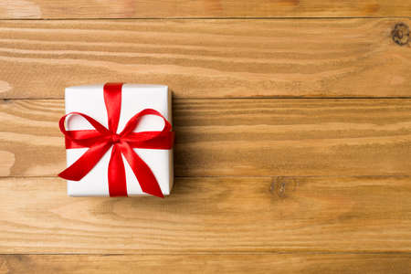 Top view of gift box on wooden background.の写真素材