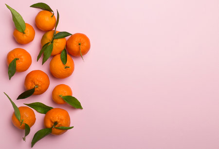 Flat lay with fresh mandarines on color background. Top view.の写真素材