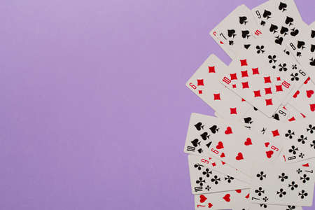 Playing cards on color background. Gambling concept. Top view.