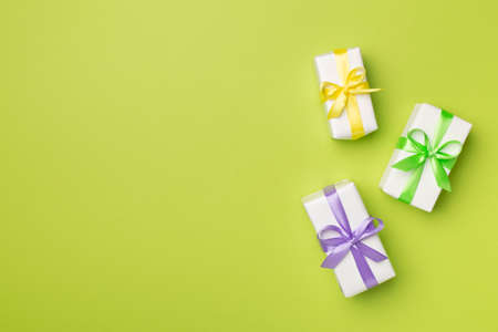 Colorful gift boxes on color background, top view.の写真素材
