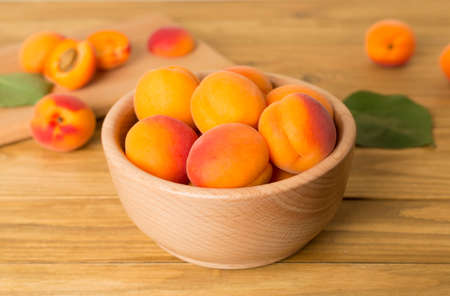 Composition with ripe apricots on wooden table.の写真素材
