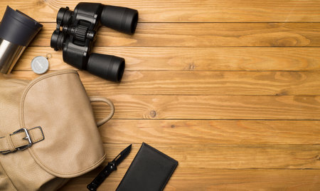 Travel accessories for mountain trip on wooden background, top view.の写真素材