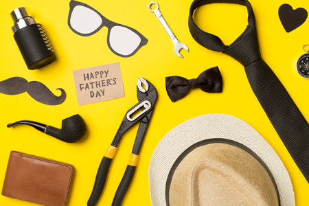 Happy Father's Day inscription with different gifts on color background, top view.の写真素材