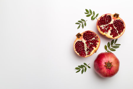 Fresh juicy pomegranate on white background, top viewの写真素材