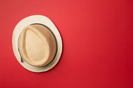 Straw hat on color background, top view.の写真素材