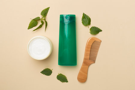 Shampoo with nettle extract on color background, top view.の写真素材