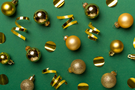 Christmas balls on color background, top view.
