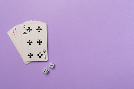 Playing cards and dices on color background. Gambling concept. Top view.