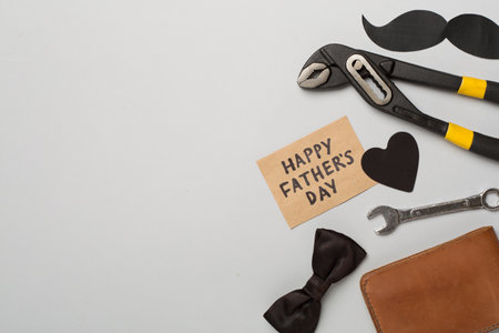 Happy Father's Day inscription with different gifts on color background, top view.