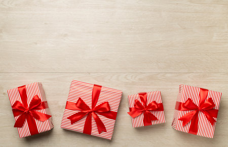 Gift boxes on wooden background, top view.の写真素材
