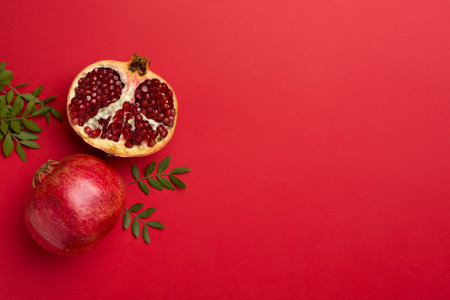 Fresh juicy pomegranate on color background, top view.の写真素材