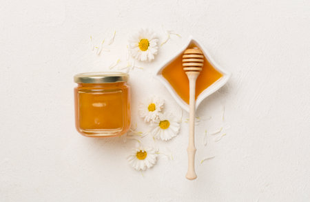 Composition with fresh honey on concrete background, top view.の写真素材