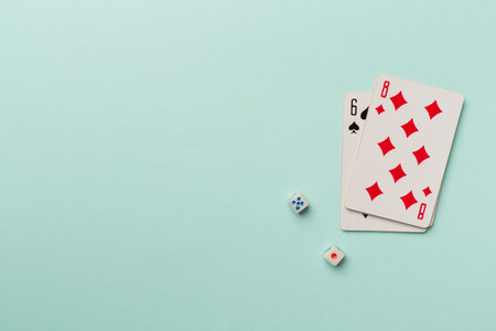 Playing cards and dices on color background. Gambling concept. Top view.