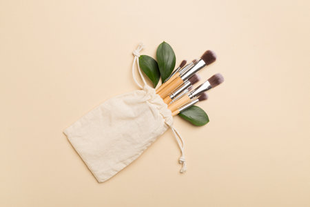 Natural biodegradable makeup brushes on color background, top viewの写真素材