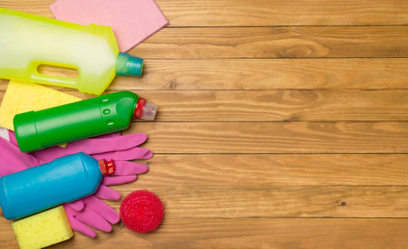 Many different house cleaning products on wooden background, top view.の写真素材