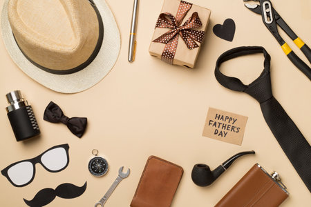 Happy Father's Day inscription with different gifts on color background, top view.の写真素材