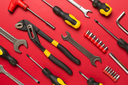 Set of tools on color background, top view