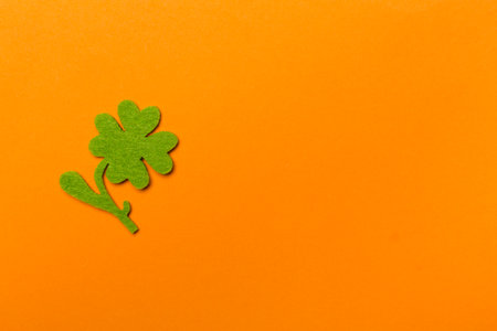 Felt clover on color background, top view. St. Patricks day conceptの写真素材