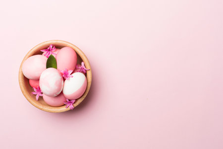 Pink Easter eggs on color background, top viewの写真素材