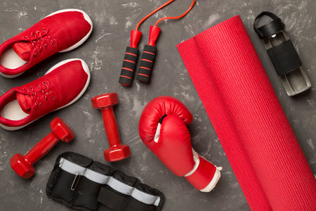 Red sport equipment on concrete background, top viewの写真素材