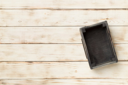 Empty wooden box on table, top view.の写真素材