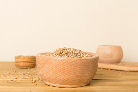 Bowls with wholegrain spelt farro on wooden table.の写真素材