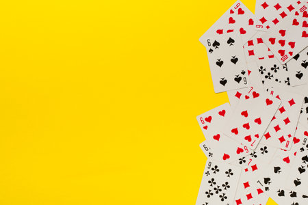 Playing cards on color background. Gambling concept. Top view.