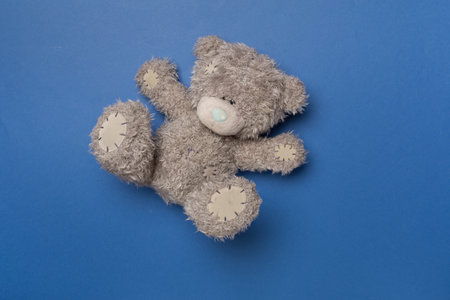 Cute teddy bear on color background, top viewの写真素材