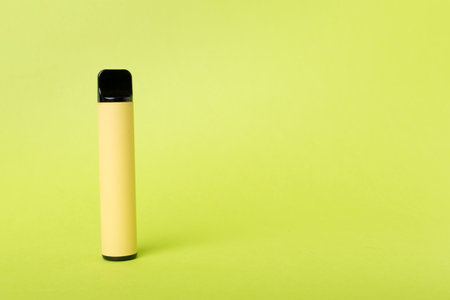 Disposable electronic cigarette on color backgroundの写真素材