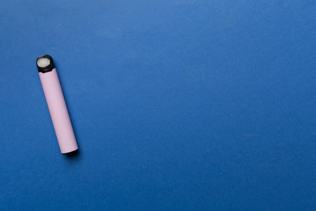 Disposable electronic cigarettes on color background, top viewの写真素材