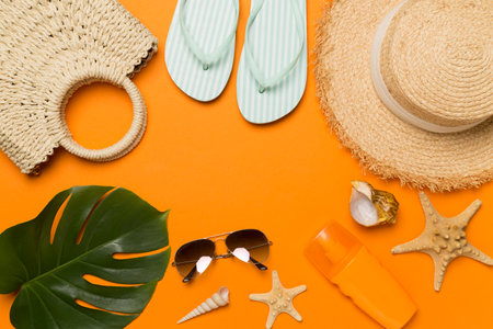 Beach accessories on color background, flat layの写真素材