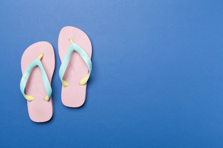 Bright flip flops on color background, top viewの写真素材