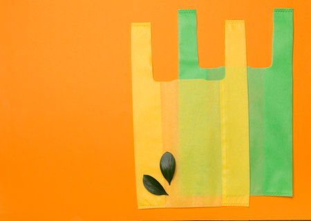 Biodegradable bags on color background, top viewの写真素材