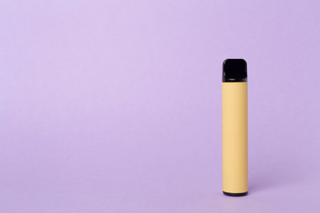 Disposable electronic cigarette on color backgroundの写真素材