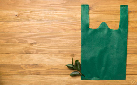 Fabric bag on color background, top view. Biodegradable products concept
