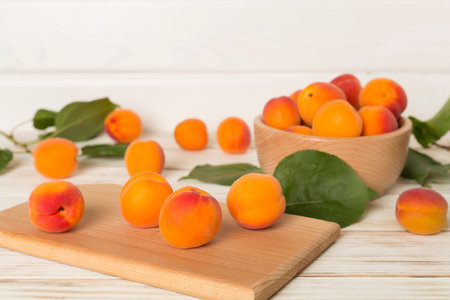 Composition with ripe apricots on wooden background, top view.の写真素材